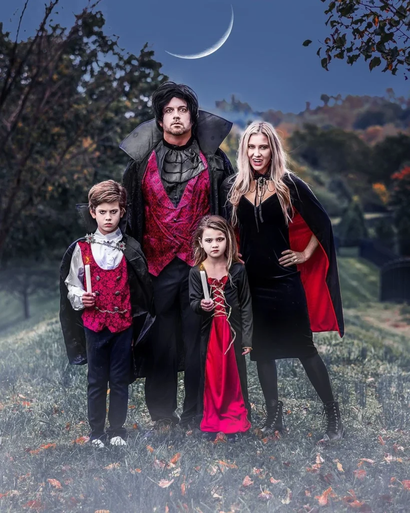 four family members in scary vampire halloween costumes